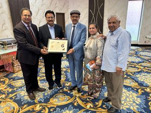 Presenting Appreciation Certificate To Shuja uz Zaman Shad,By President ICA Shoaib Nasir, Basharat Rehan, Shahid Hashmi & Seema Hashmi.